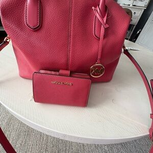 Michael Kors Pink Satchel with Gold Accents and matching wallet included.